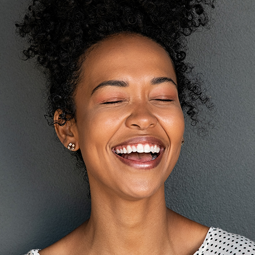 black-carefree-woman-laughing-QY76GB7