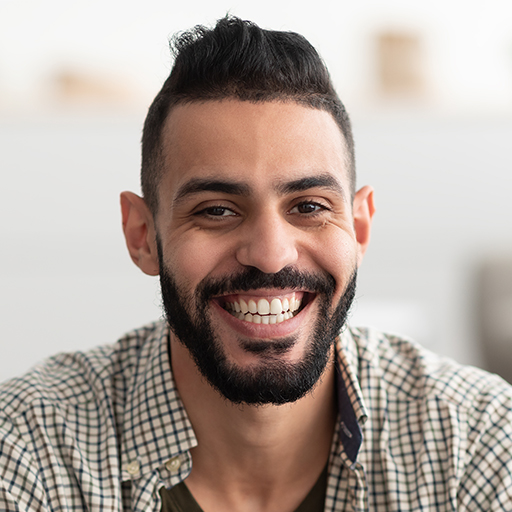 portrait-of-attractive-young-arab-man-smiling-and--A5D3UFF